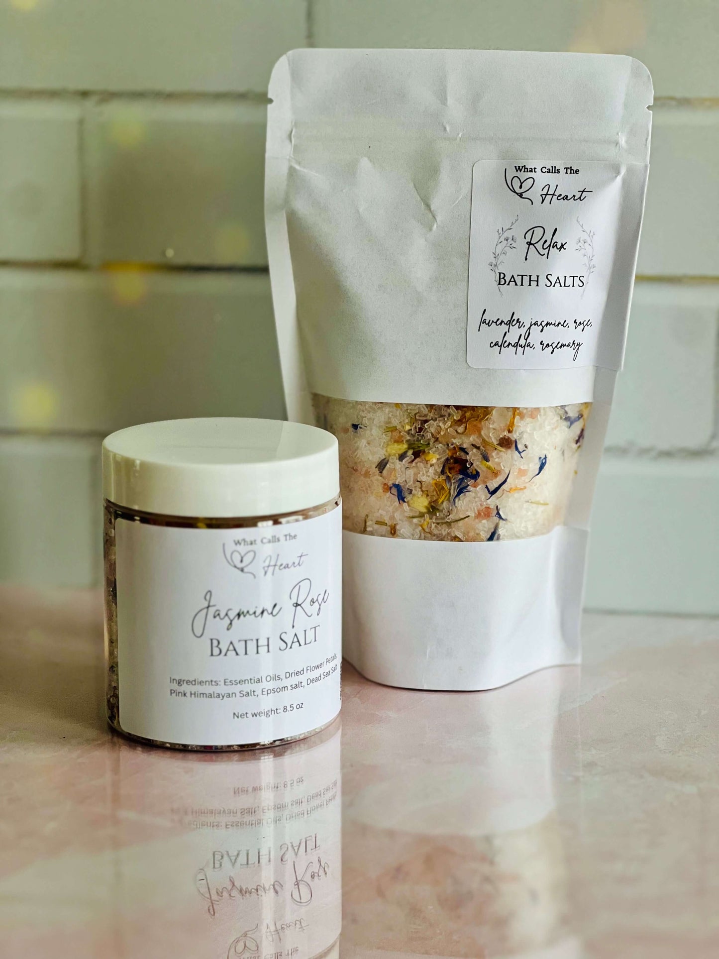 Handmade Jasmine Rose bath salts in jars and pouches, crafted with natural ingredients for a soothing soak.