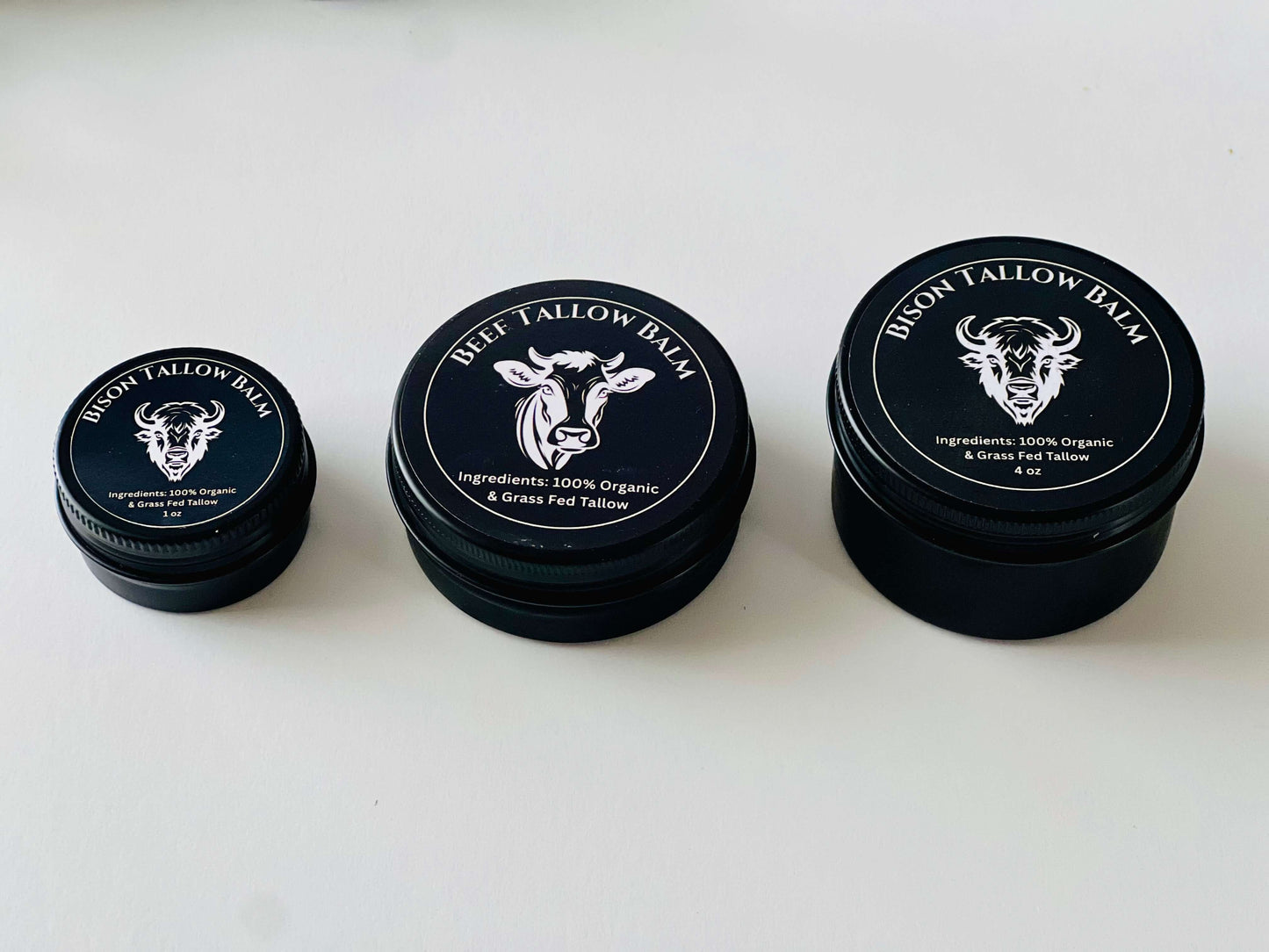 Three jars of organic bison and beef tallow balm, labeled with ingredients and benefits for skin nourishment.