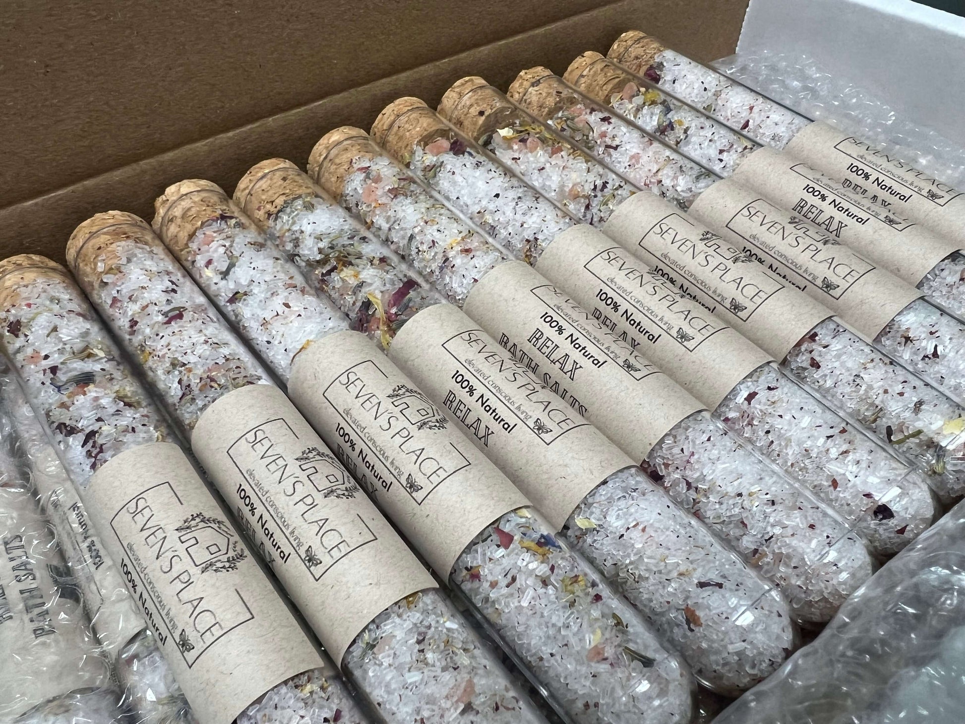 Mixed bath salts in eco-friendly tubes, featuring natural ingredients for relaxation and skin soothing.