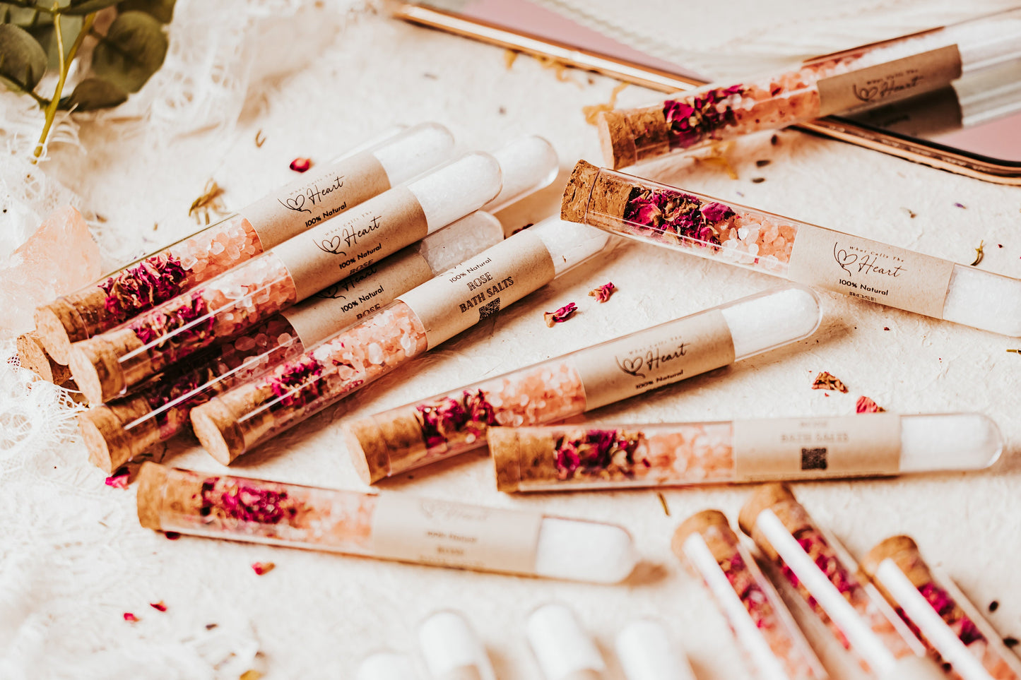 Our bath salt tubes pictured here, with white epsom and pink himalayn salt, then topped off with beautiful rose petals. Customize the label for your special occasion!